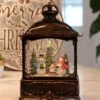 11 Inch Decorative Bronze Water Lantern With Snow Family Sledding In Swirling Glitter
